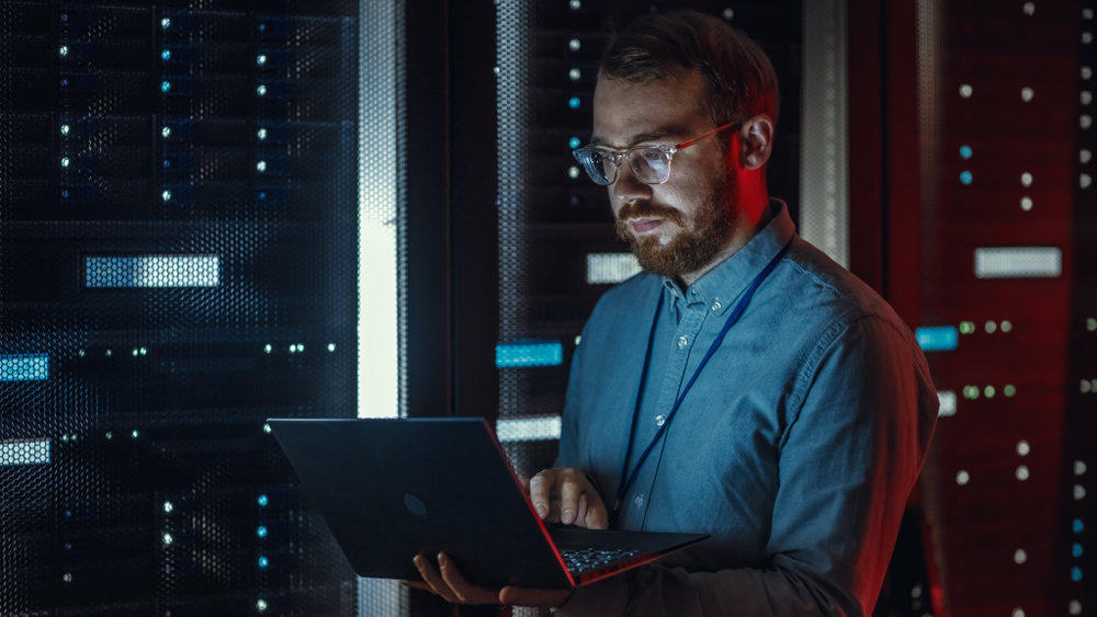 Bearded,It,Specialist,In,Glasses,Is,Working,On,Laptop,In