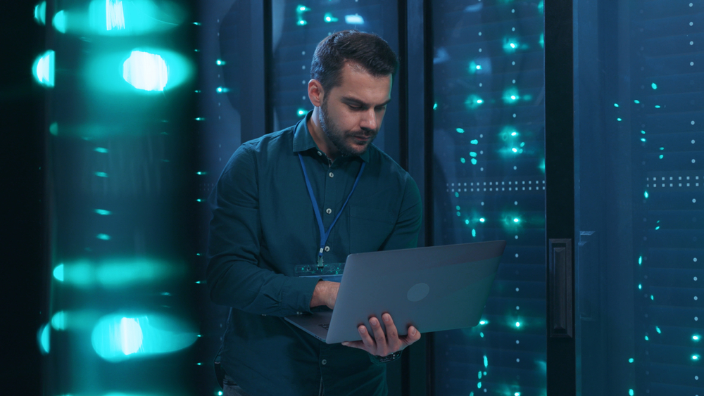 Caucasian,It,Professional,Admin,Using,Laptop,Computer,Doing,Data,Transfer